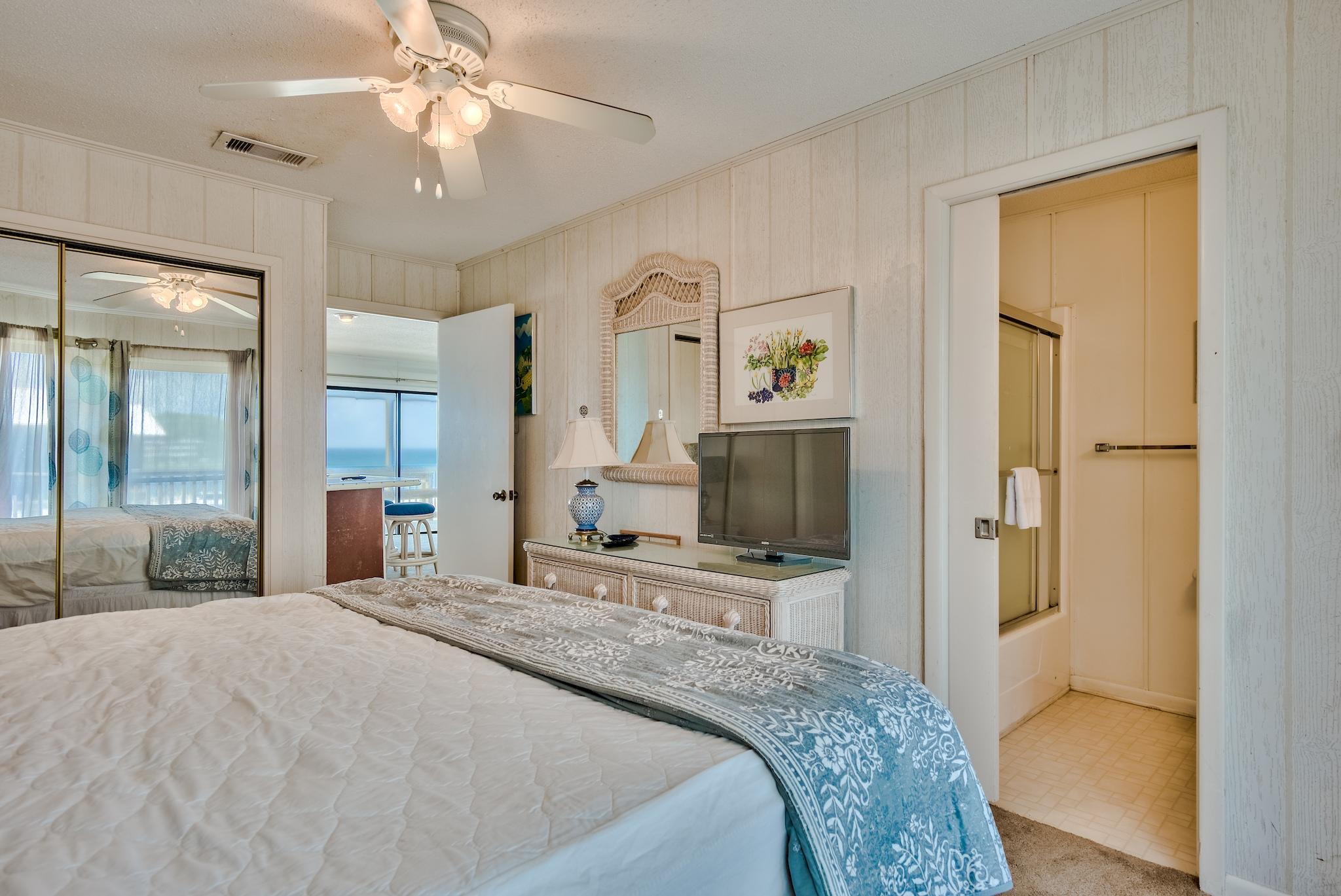 5357 West County Highway 30A Santa Rosa Beach, FL 32459 - Photo 15 of 22 a bedroom with a bed and a flat screen tv