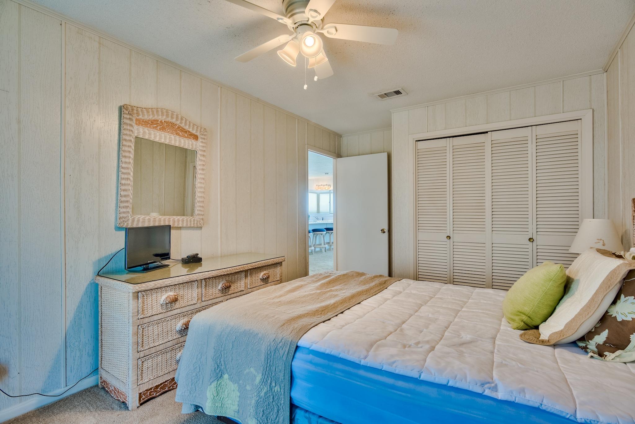 5357 West County Highway 30A Santa Rosa Beach, FL 32459 - Photo 18 of 22 a bedroom with a bed and a dresser
