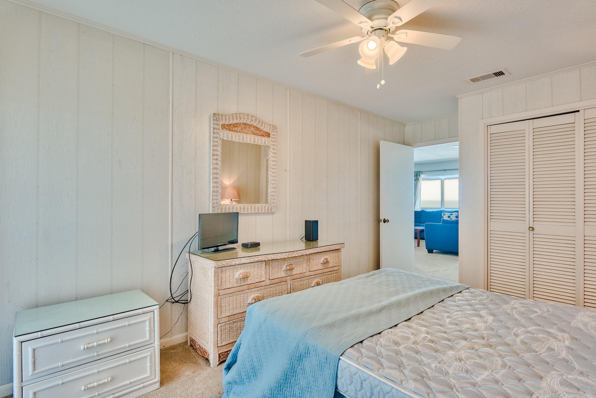 5357 West County Highway 30A Santa Rosa Beach, FL 32459 - Photo 21 of 22 a bedroom with a bed and a chandelier
