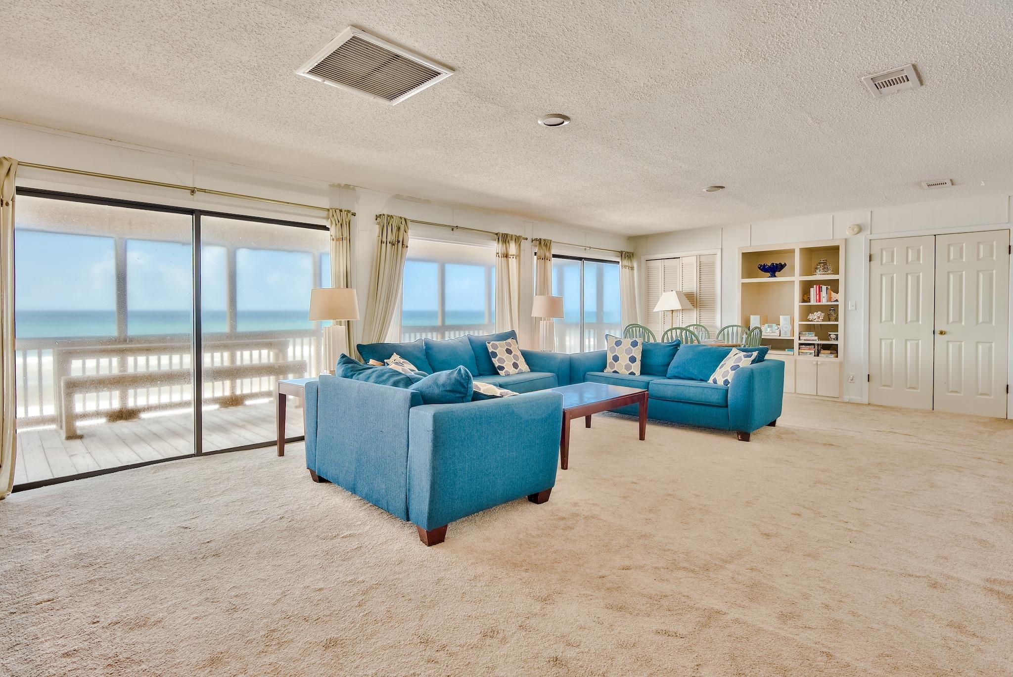 5357 West County Highway 30A Santa Rosa Beach, FL 32459 - Photo 9 of 22 a living room with furniture and a floor to ceiling window
