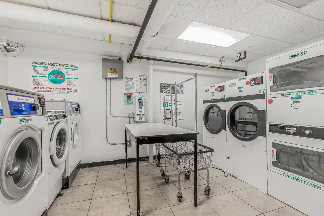 15 Fort Washington Avenue, Unit 3A Manhattan, NY 10032 - Photo 13 of 15 a utility room with dryer and washer