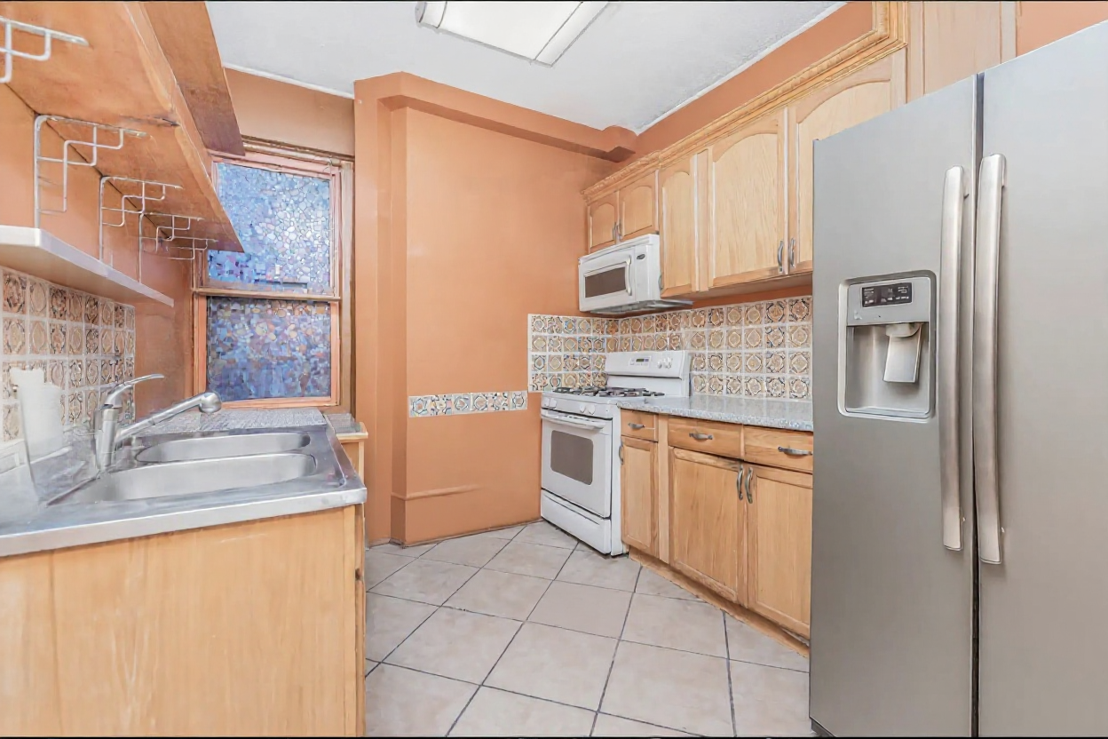 15 Fort Washington Avenue, Unit 3A Manhattan, NY 10032 - Photo 4 of 15 a kitchen with stainless steel appliances granite countertop a refrigerator and a sink