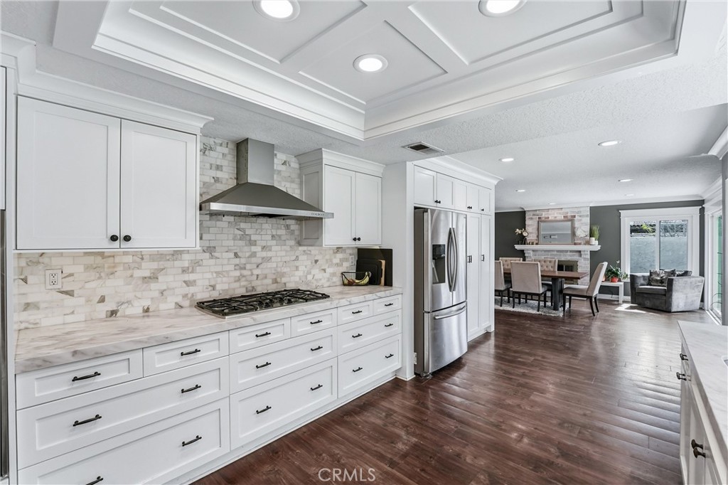 282 North Willow Springs Road Orange, CA 92869 - Photo 13 of 43 a kitchen with stainless steel appliances granite countertop a refrigerator and stove top oven