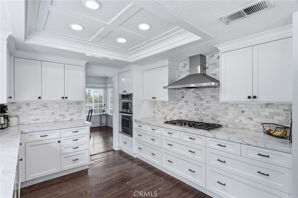 282 North Willow Springs Road Orange, CA 92869 - Photo 14 of 43 a kitchen with stainless steel appliances white cabinets and a stove
