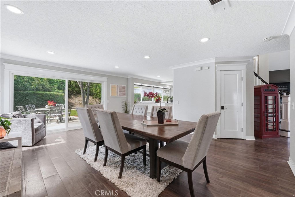 282 North Willow Springs Road Orange, CA 92869 - Photo 18 of 43 a view of a dining room with furniture window and wooden floor
