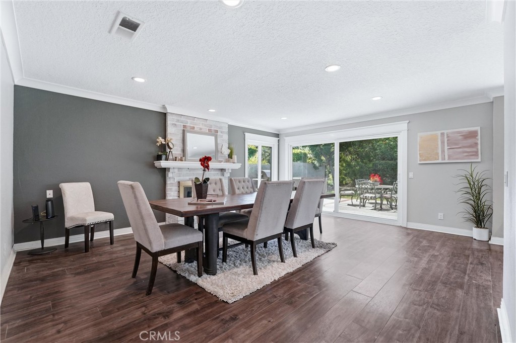 282 North Willow Springs Road Orange, CA 92869 - Photo 19 of 43 a view of a dining room with furniture and wooden floor