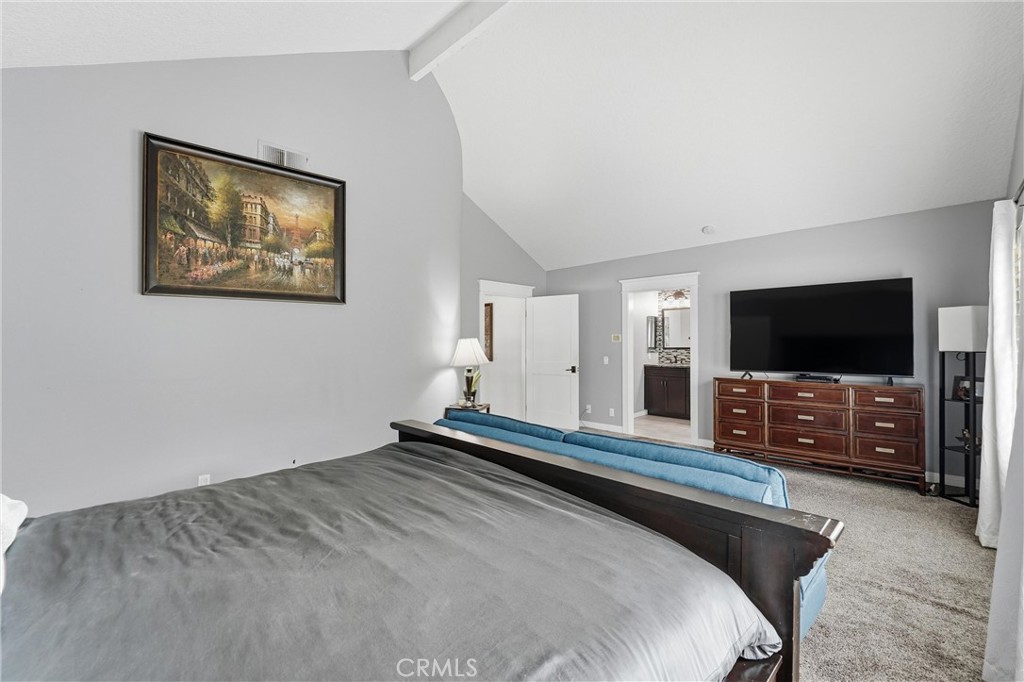 282 North Willow Springs Road Orange, CA 92869 - Photo 24 of 43 a bedroom with a large bed and a flat screen tv