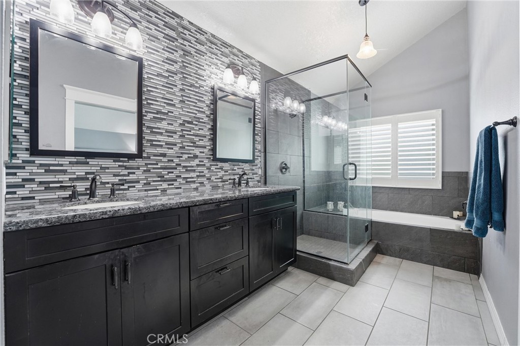 282 North Willow Springs Road Orange, CA 92869 - Photo 25 of 43 a bathroom with a sink double vanity granite tub shower and a mirror