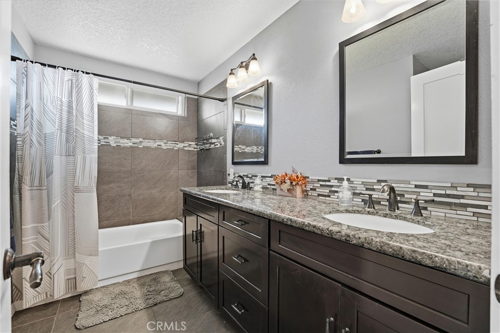282 North Willow Springs Road Orange, CA 92869 - Photo 29 of 43 a bathroom with a granite countertop sink mirror toilet and bathtub