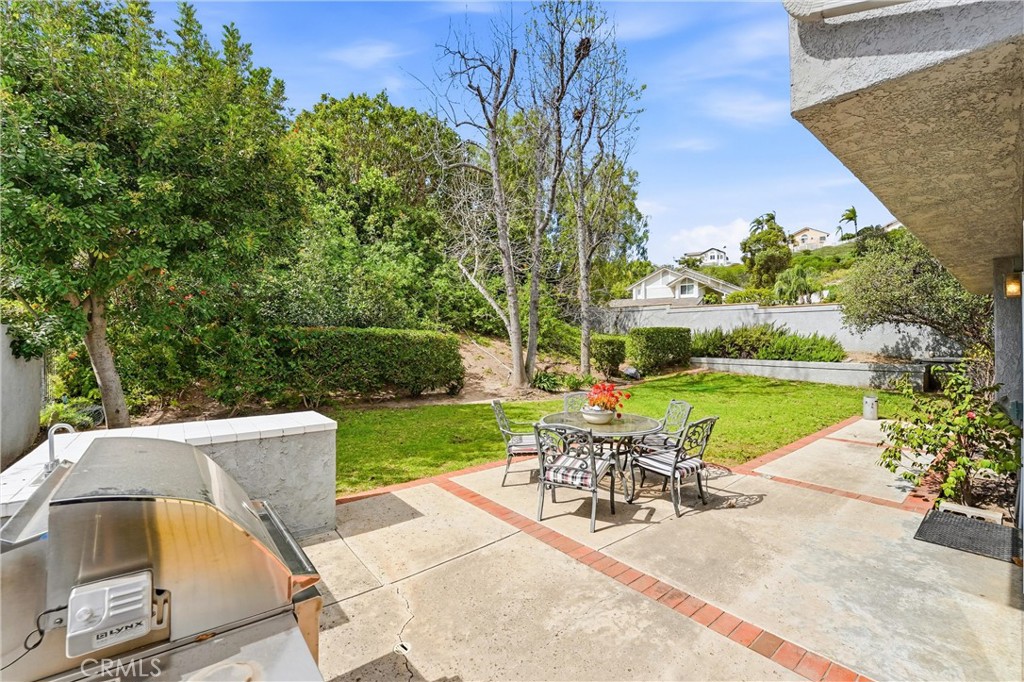 282 North Willow Springs Road Orange, CA 92869 - Photo 31 of 43 a view of a patio with a table chairs and a table