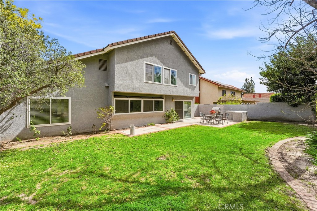 282 North Willow Springs Road Orange, CA 92869 - Photo 33 of 43 a front view of a house with a garden