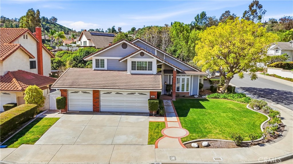 282 North Willow Springs Road Orange, CA 92869 - Photo 37 of 43 a front view of a house with a garden and plants