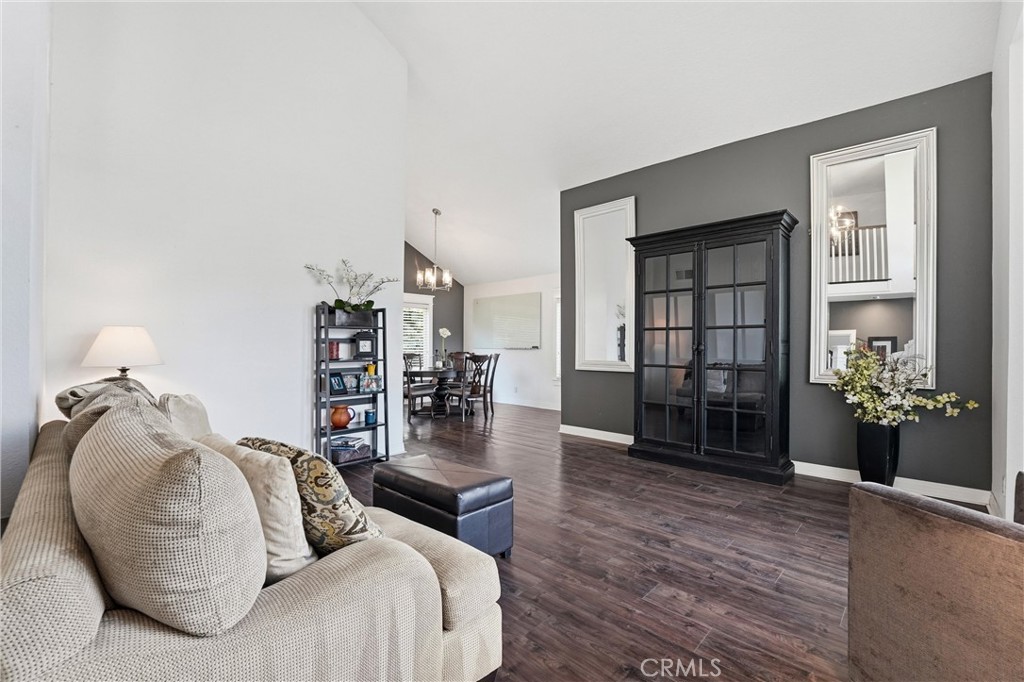 282 North Willow Springs Road Orange, CA 92869 - Photo 6 of 43 a living room with furniture a rug and a book shelf