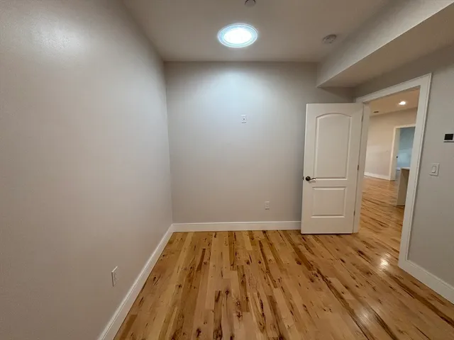 a view of wooden floor in an empty room