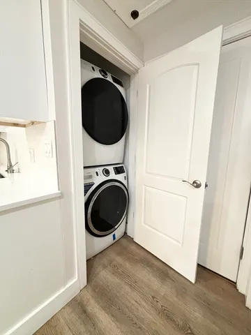a view of a hallway with washer and dryer
