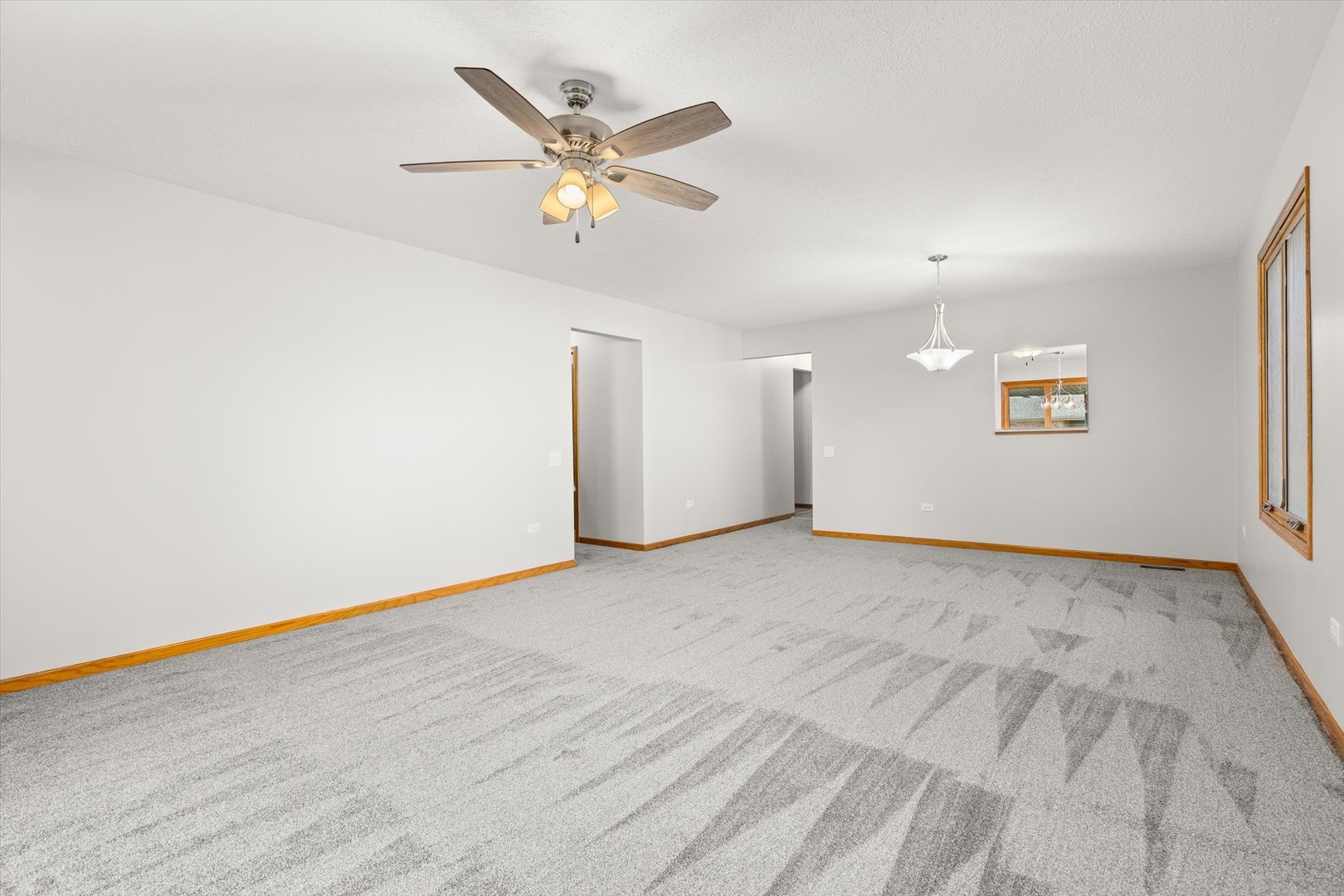822 Eagle Creek Road Elwood, IL 60421 - Photo 16 of 41 an empty room with a empty space and a ceiling fan