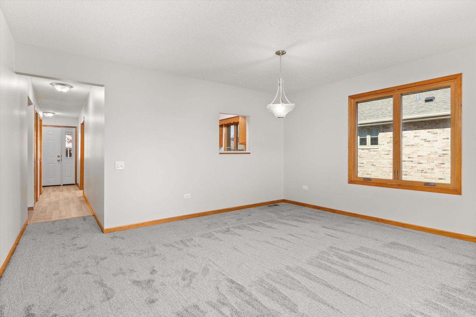 822 Eagle Creek Road Elwood, IL 60421 - Photo 17 of 41 a view of an empty room with window and wooden floor