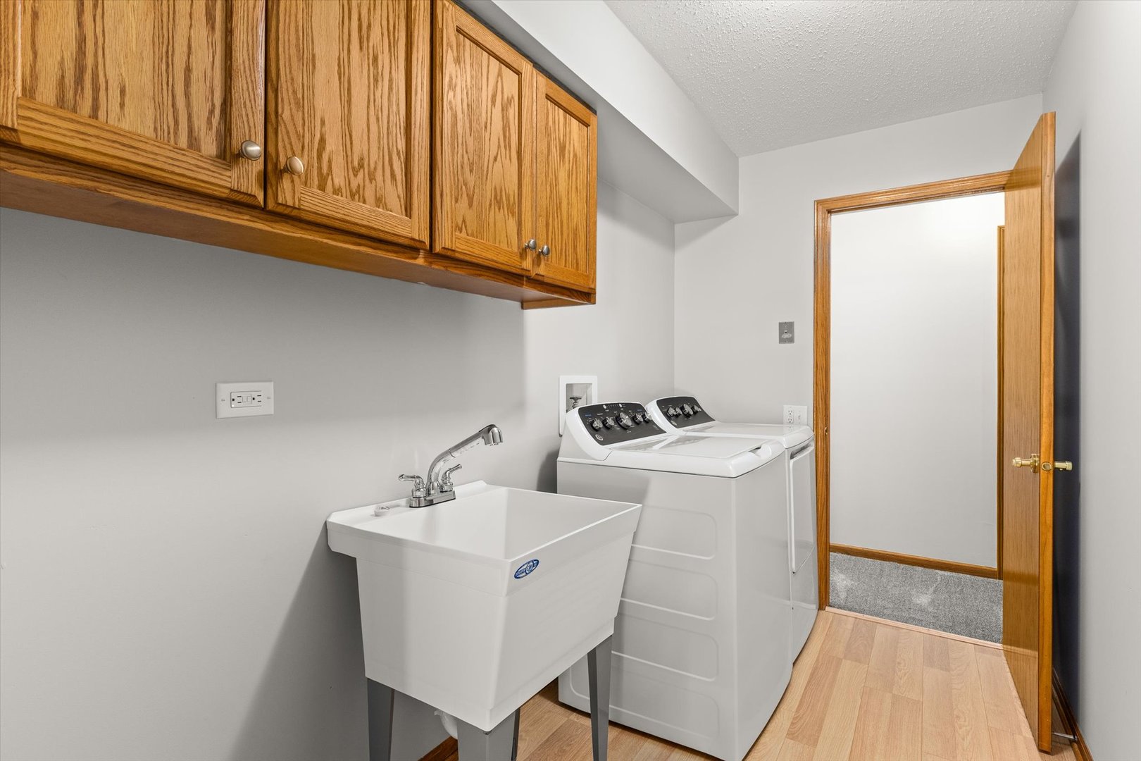 822 Eagle Creek Road Elwood, IL 60421 - Photo 18 of 41 a white kitchen with a sink and cabinets