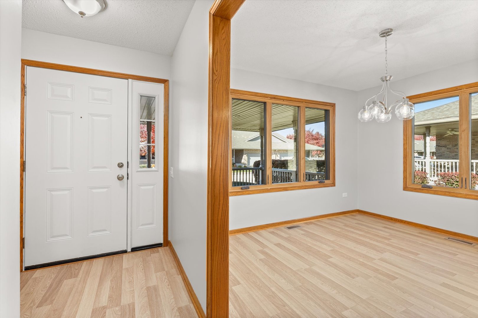 822 Eagle Creek Road Elwood, IL 60421 - Photo 6 of 41 a view of an empty room with wooden floor and a window