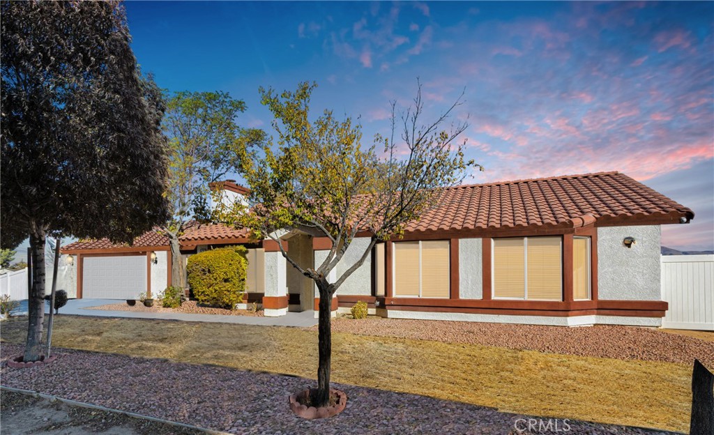 15747 Ute Road Apple Valley, CA 92307 - Photo 1 of 1 a front view of a house with garden