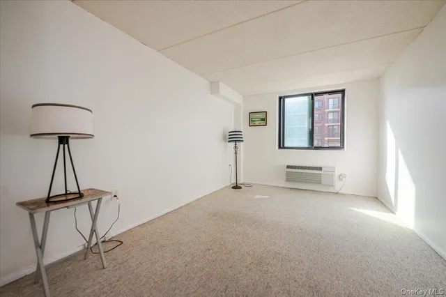 a bathroom with a shower sink mirror and toilet