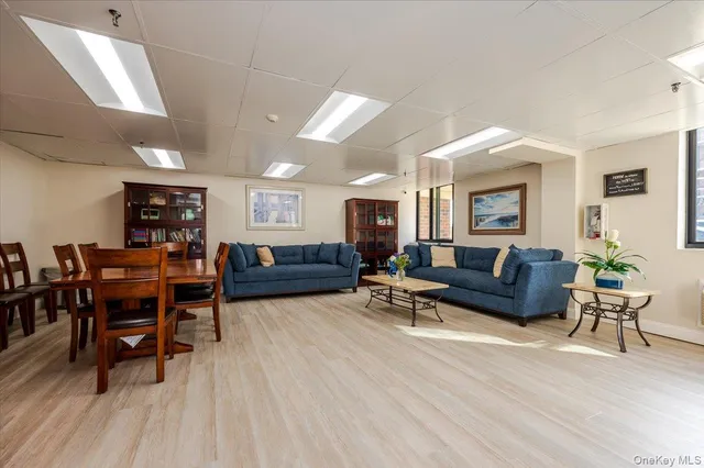 a building outdoor space with couple of cars parked in front of it