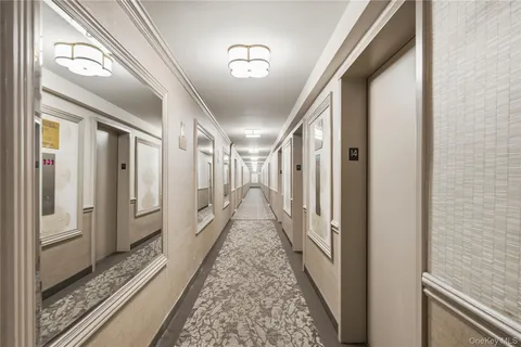 a view of a balcony with couches and wooden floor