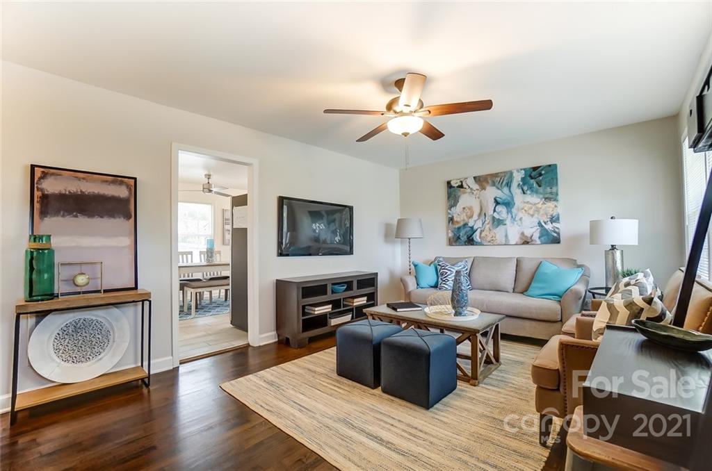 4033 Fieldcrest Road Charlotte, NC 28217 - Photo 2 of 17 a living room with furniture a flat screen tv and a rug