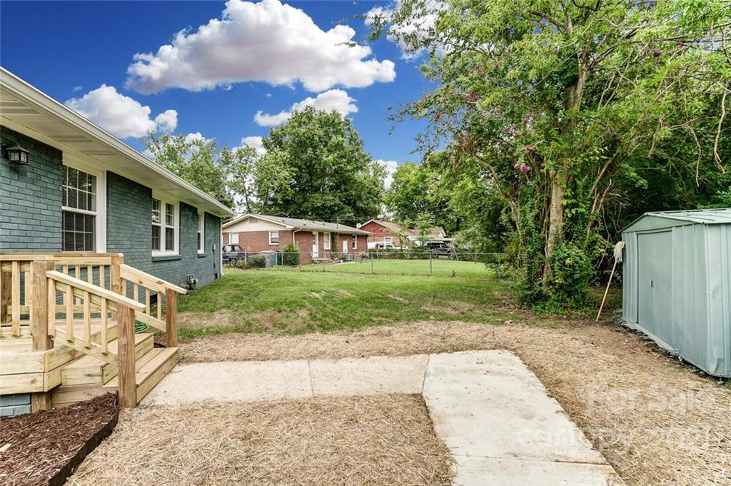 4033 Fieldcrest Road Charlotte, NC 28217 - Photo 14 of 17 a view of a house with a yard