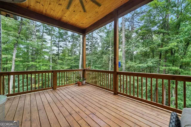 a view of balcony with wooden floor