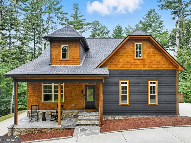 a front view of a house with yard