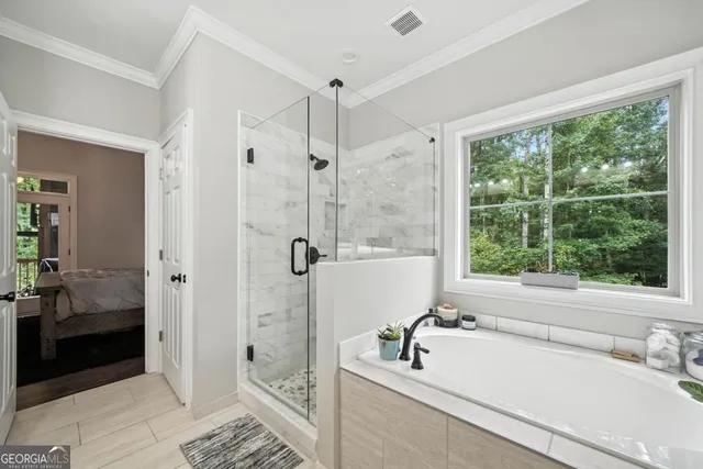a bathroom with a tub shower and sink