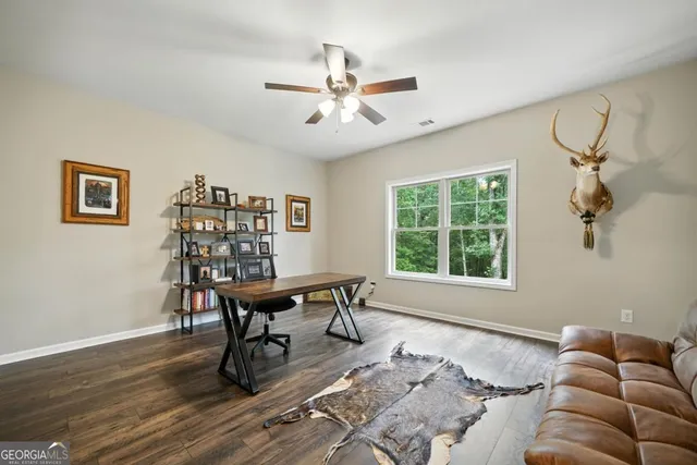 a workspace with furniture window and wooden floor