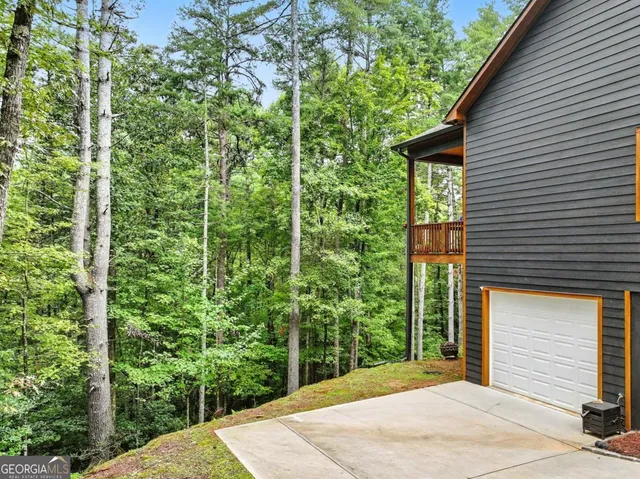 a view of house with backyard