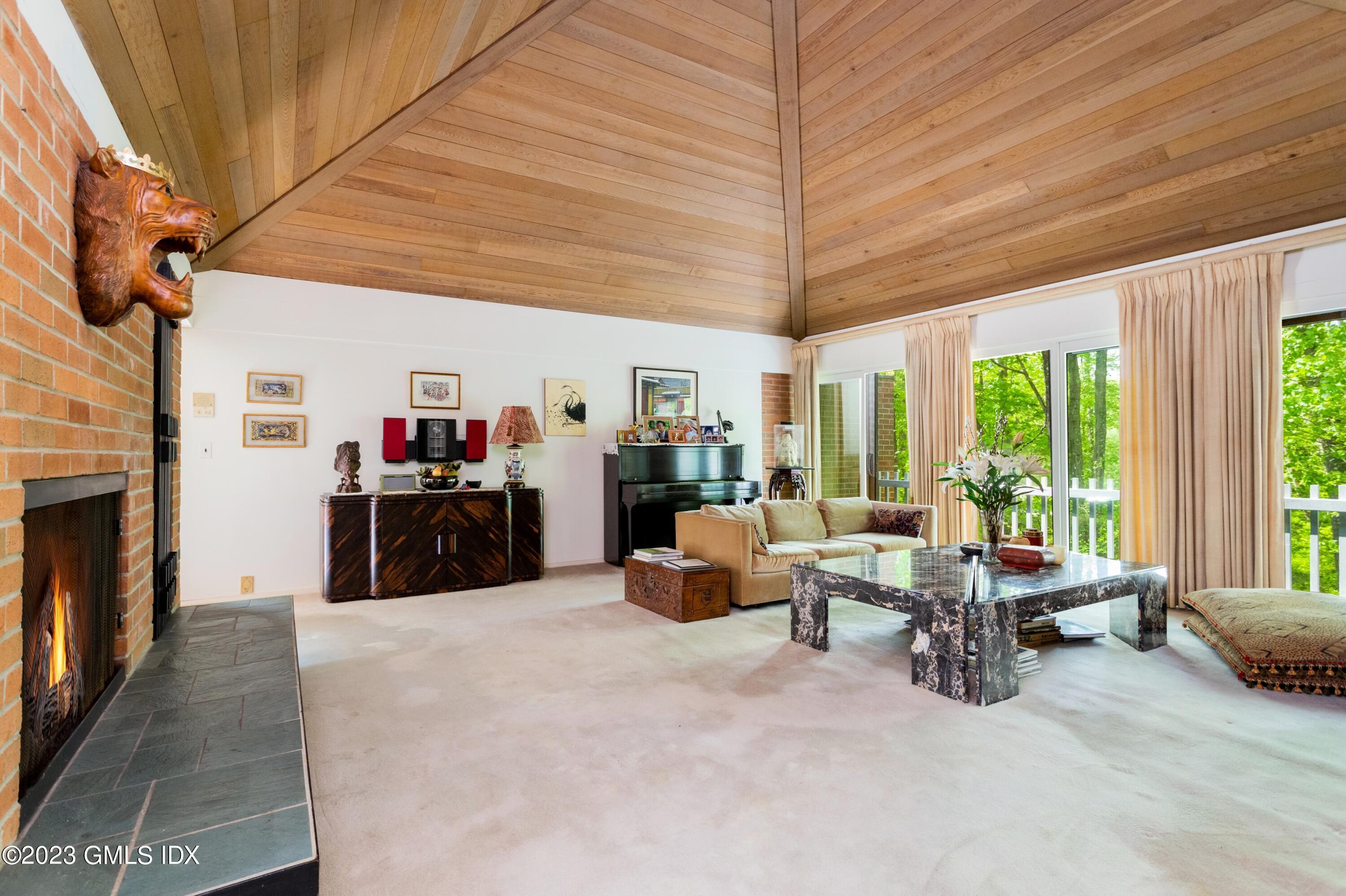140 Round Hill Road Greenwich, CT 06831 - Photo 13 of 49 a living room with furniture large window and flat screen tv