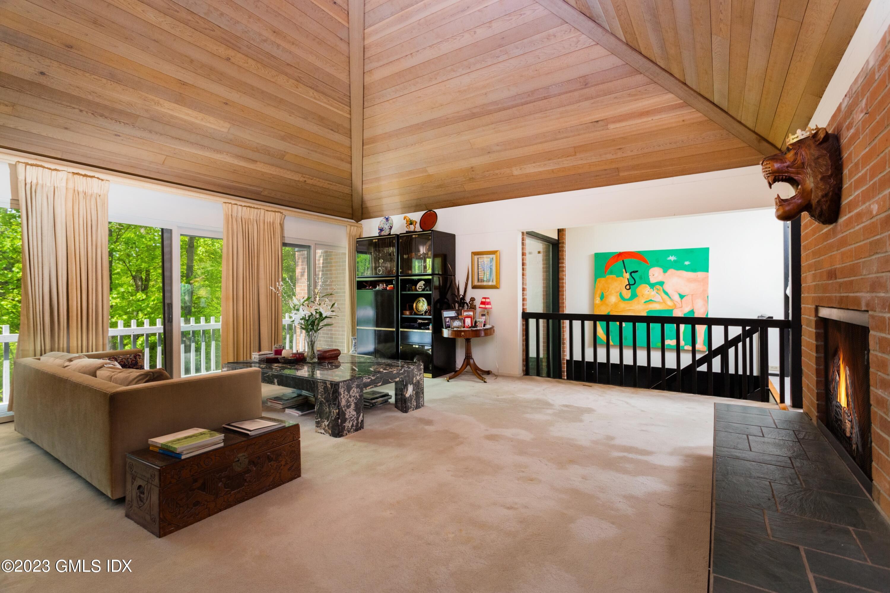 140 Round Hill Road Greenwich, CT 06831 - Photo 14 of 49 a living room with furniture and a flat screen tv