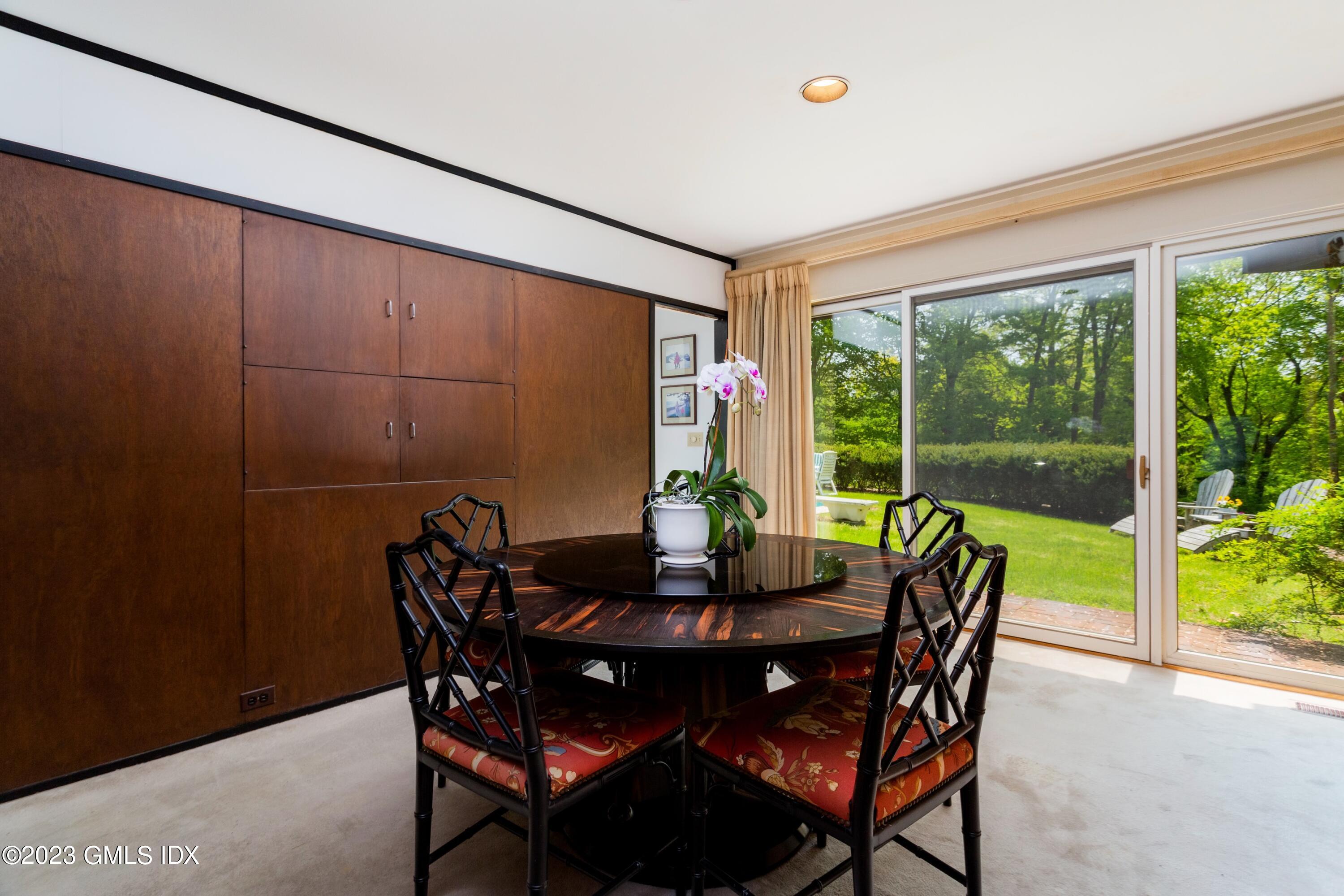 140 Round Hill Road Greenwich, CT 06831 - Photo 16 of 49 a view of a dining room with furniture window and outside view