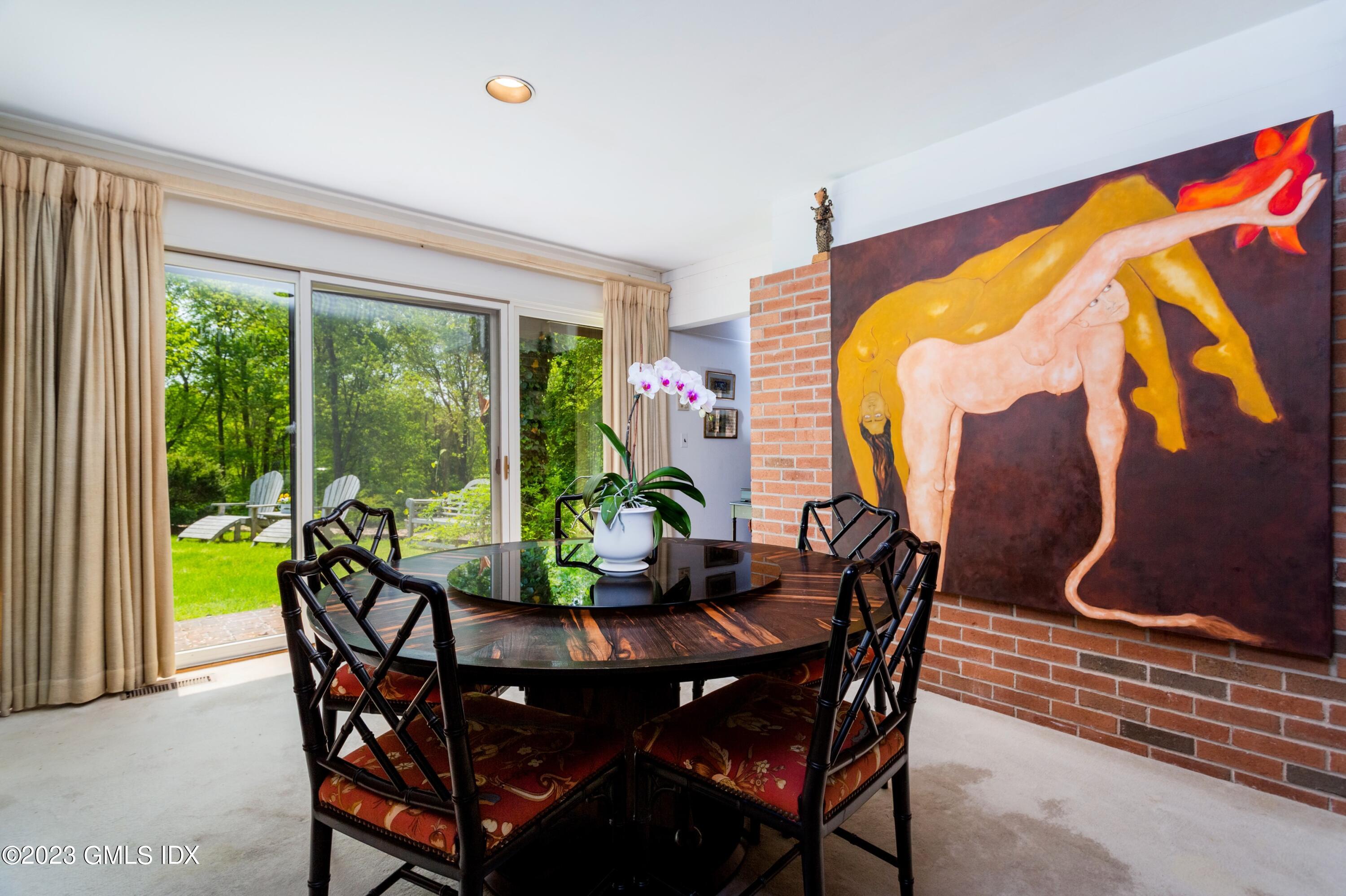 140 Round Hill Road Greenwich, CT 06831 - Photo 17 of 49 a dining room with furniture and wooden floor
