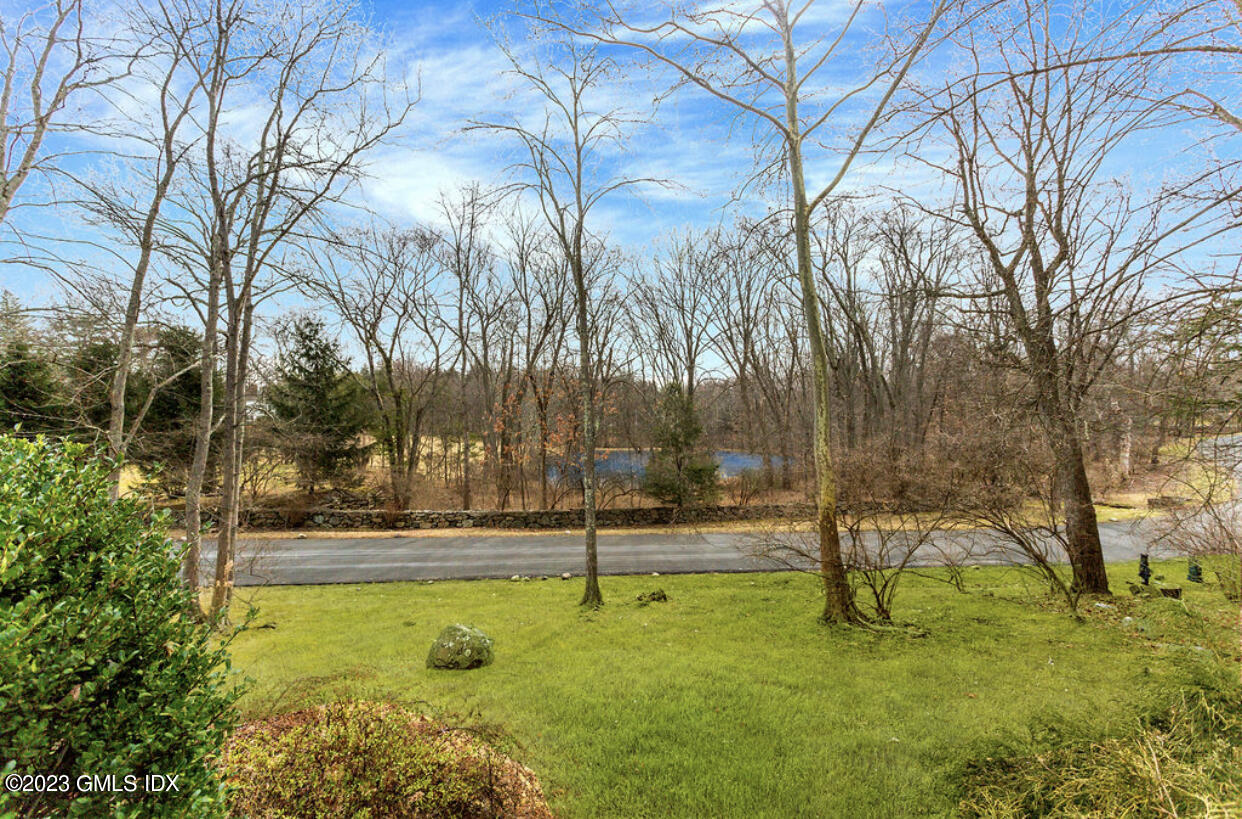 140 Round Hill Road Greenwich, CT 06831 - Photo 18 of 49 a view of a yard with swimming pool