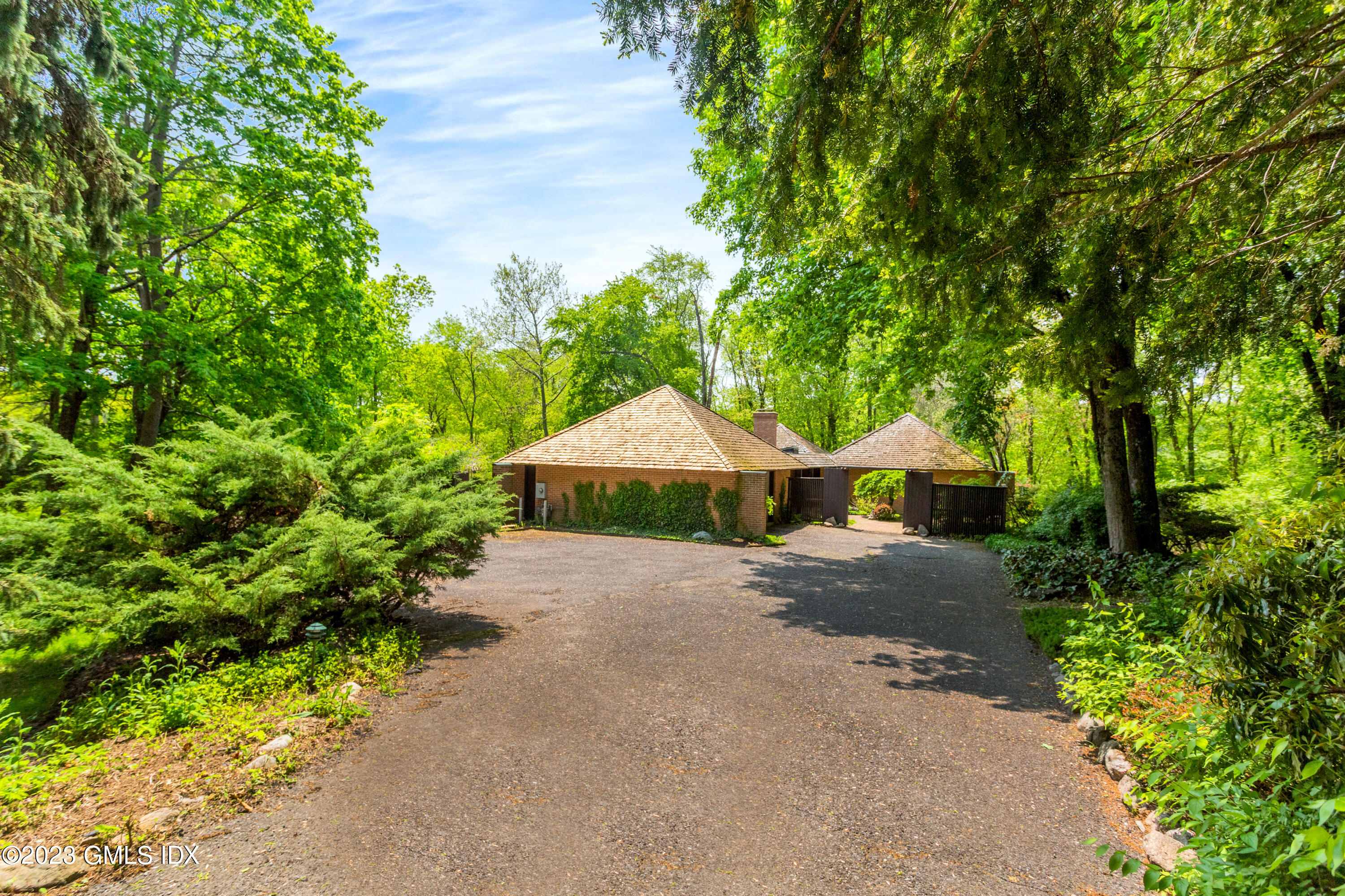 140 Round Hill Road Greenwich, CT 06831 - Photo 2 of 49 a view of a house with a street