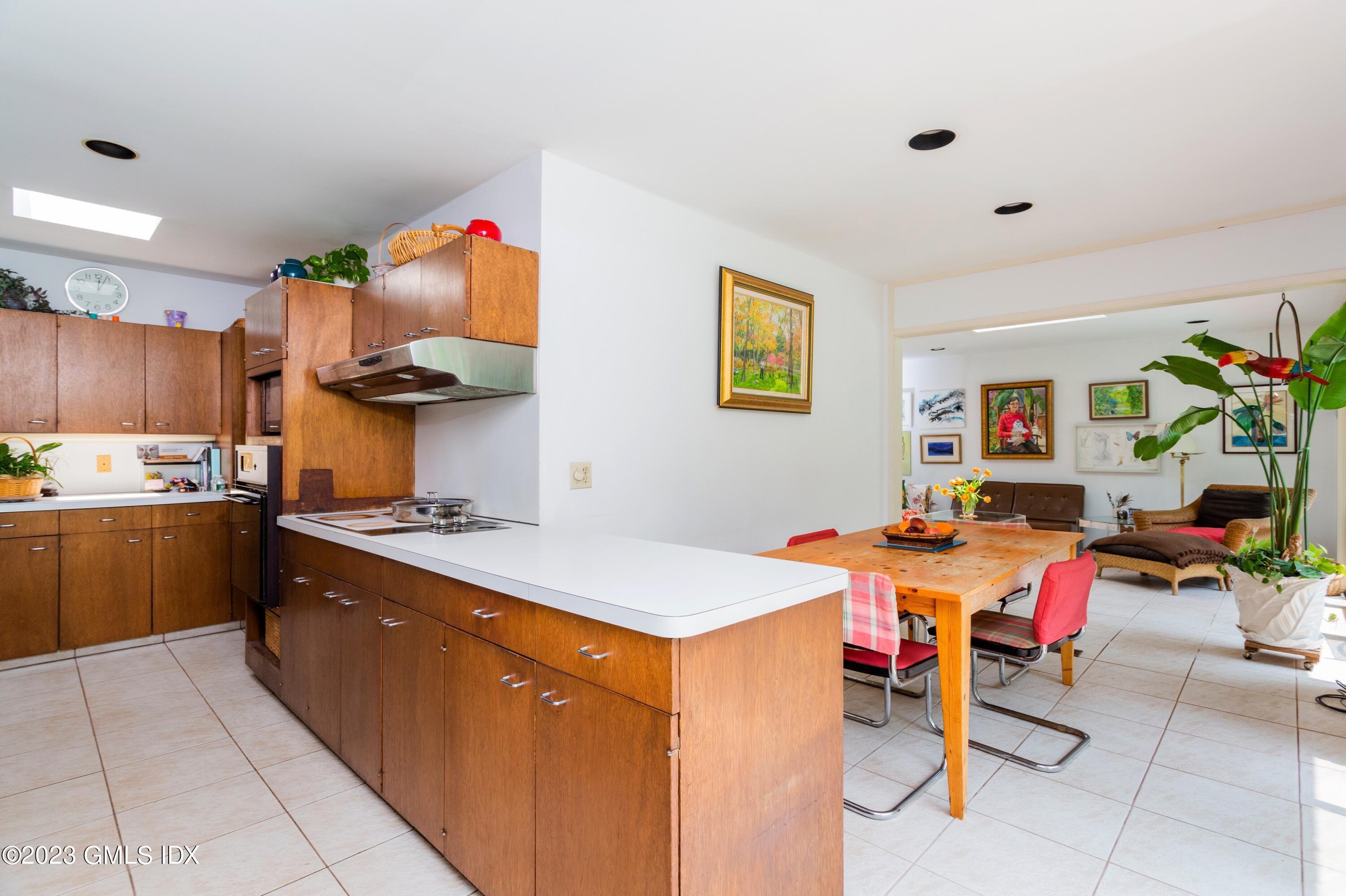 140 Round Hill Road Greenwich, CT 06831 - Photo 21 of 49 a kitchen that has a lot of cabinets a sink and a stove in it