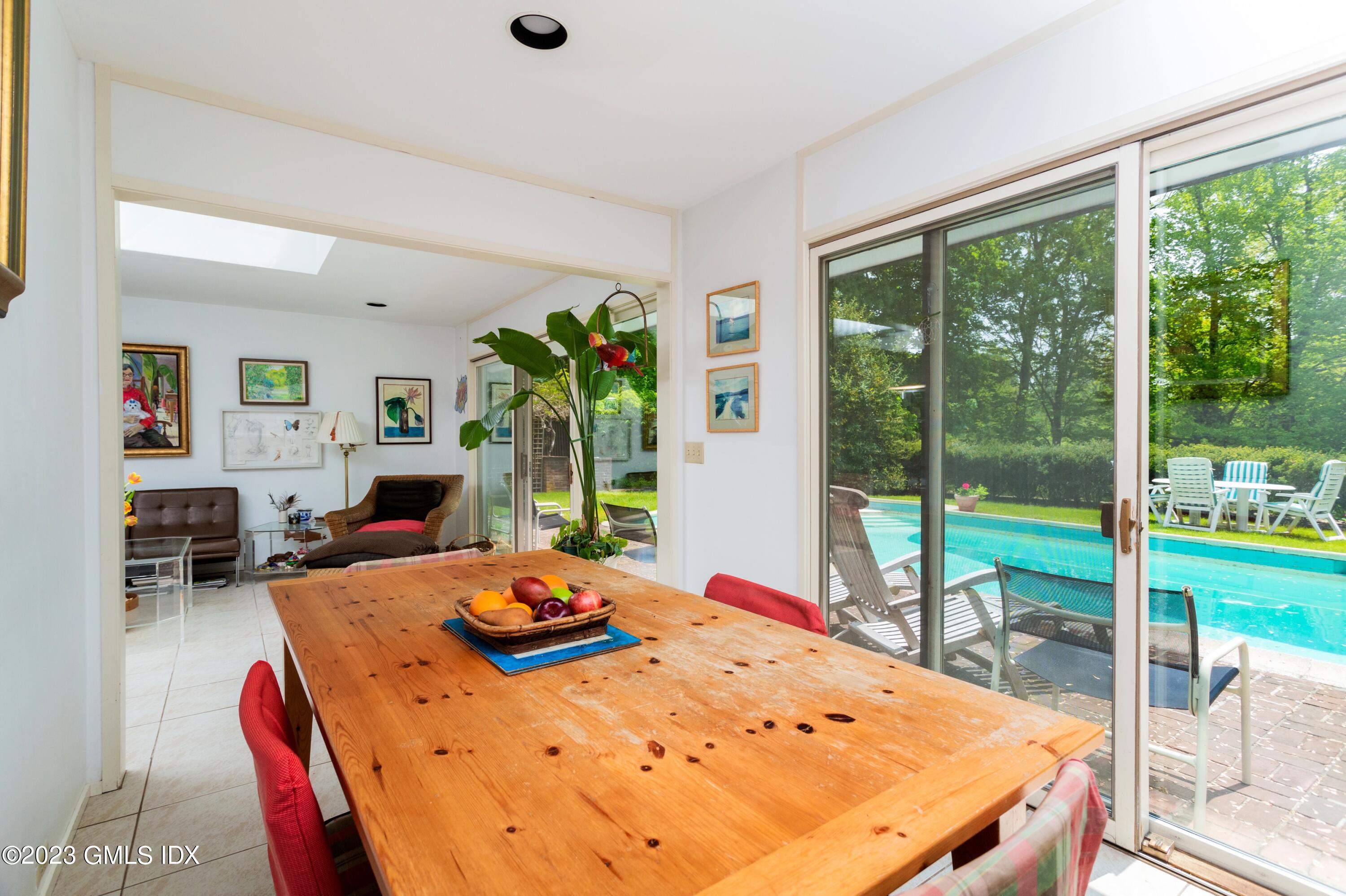 140 Round Hill Road Greenwich, CT 06831 - Photo 22 of 49 a view of a dining room with furniture window and wooden floor
