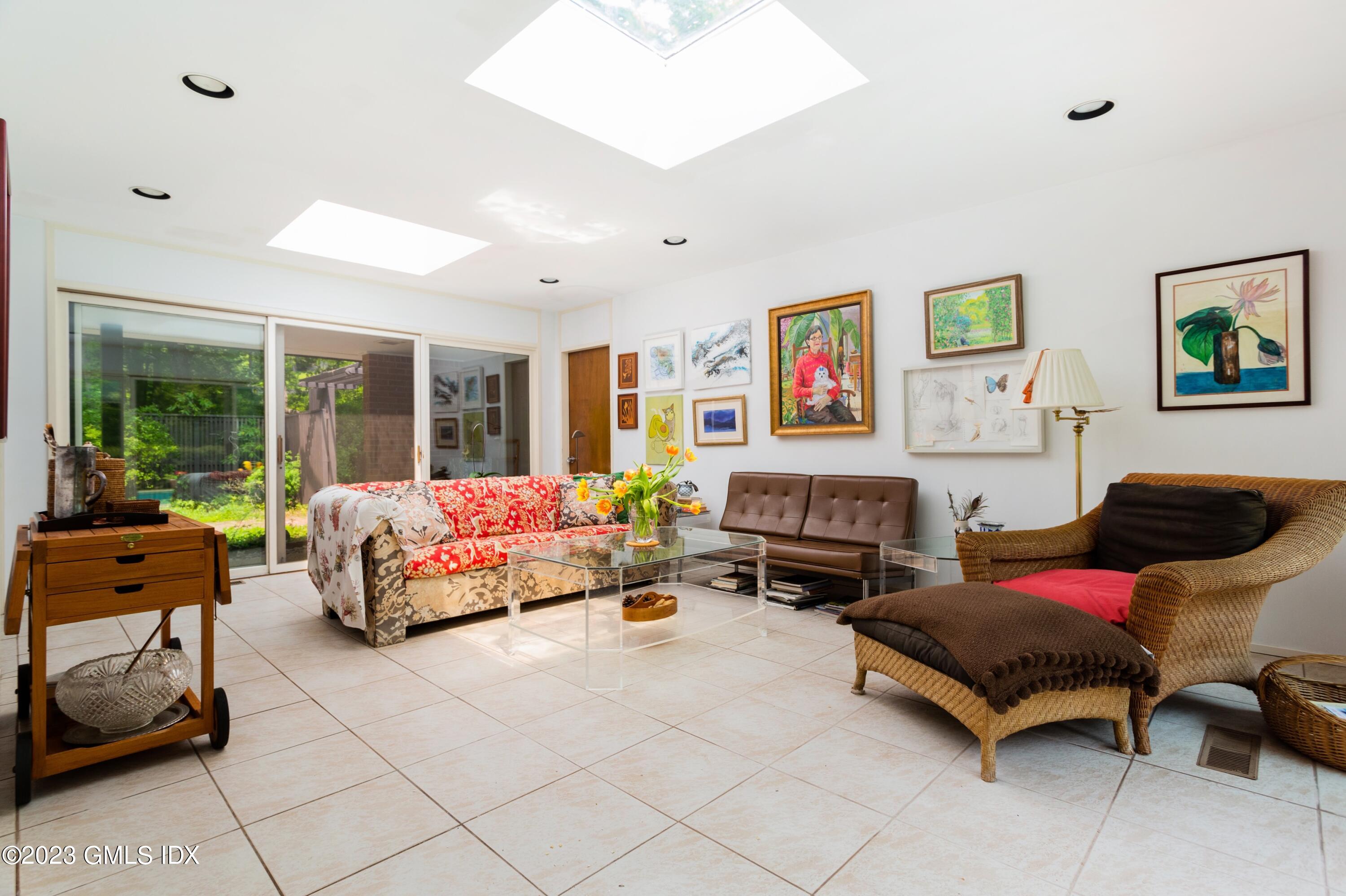 140 Round Hill Road Greenwich, CT 06831 - Photo 23 of 49 a bedroom with furniture and large windows