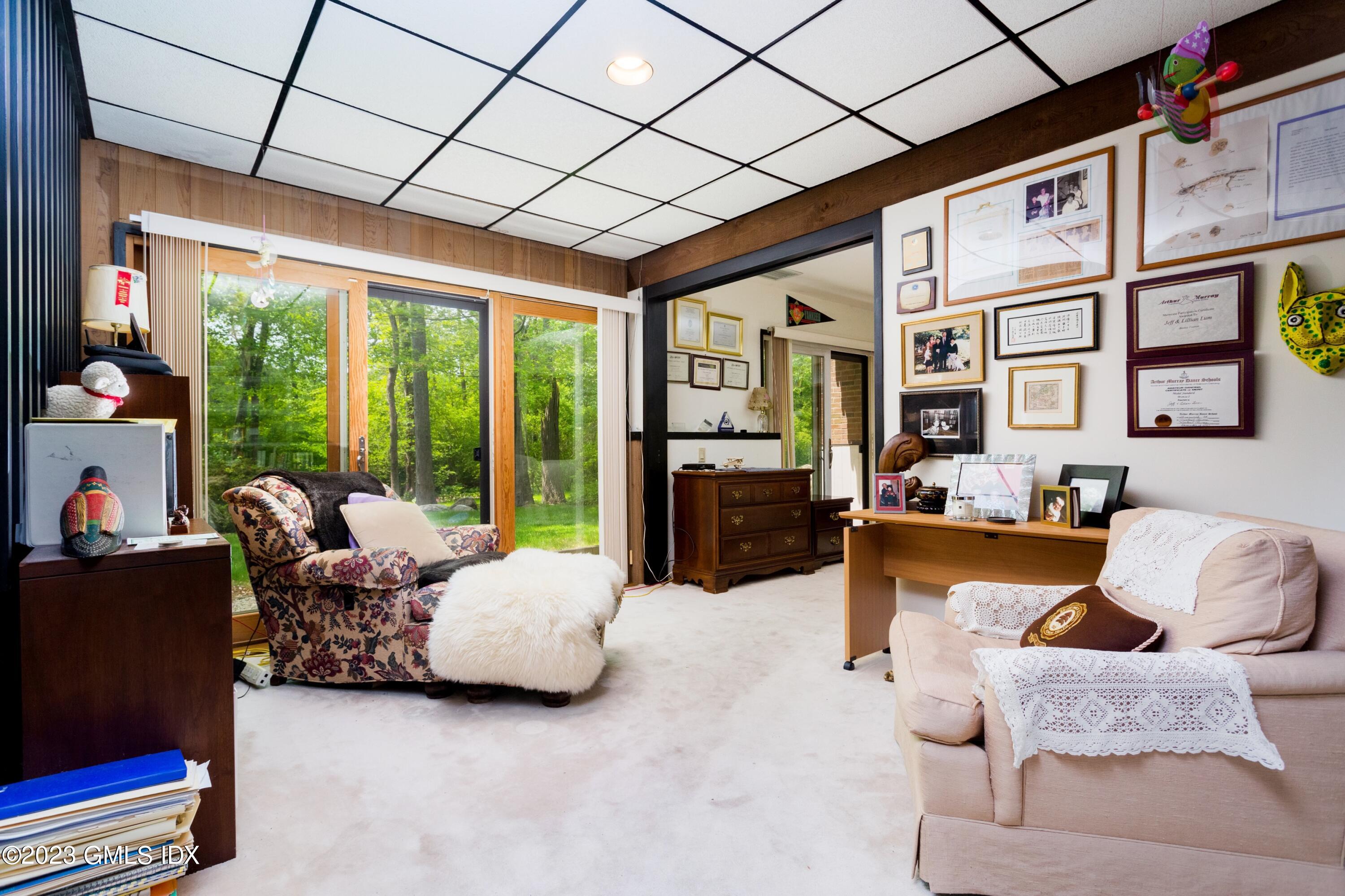 140 Round Hill Road Greenwich, CT 06831 - Photo 29 of 49 a living room with furniture ceiling fan and a rug
