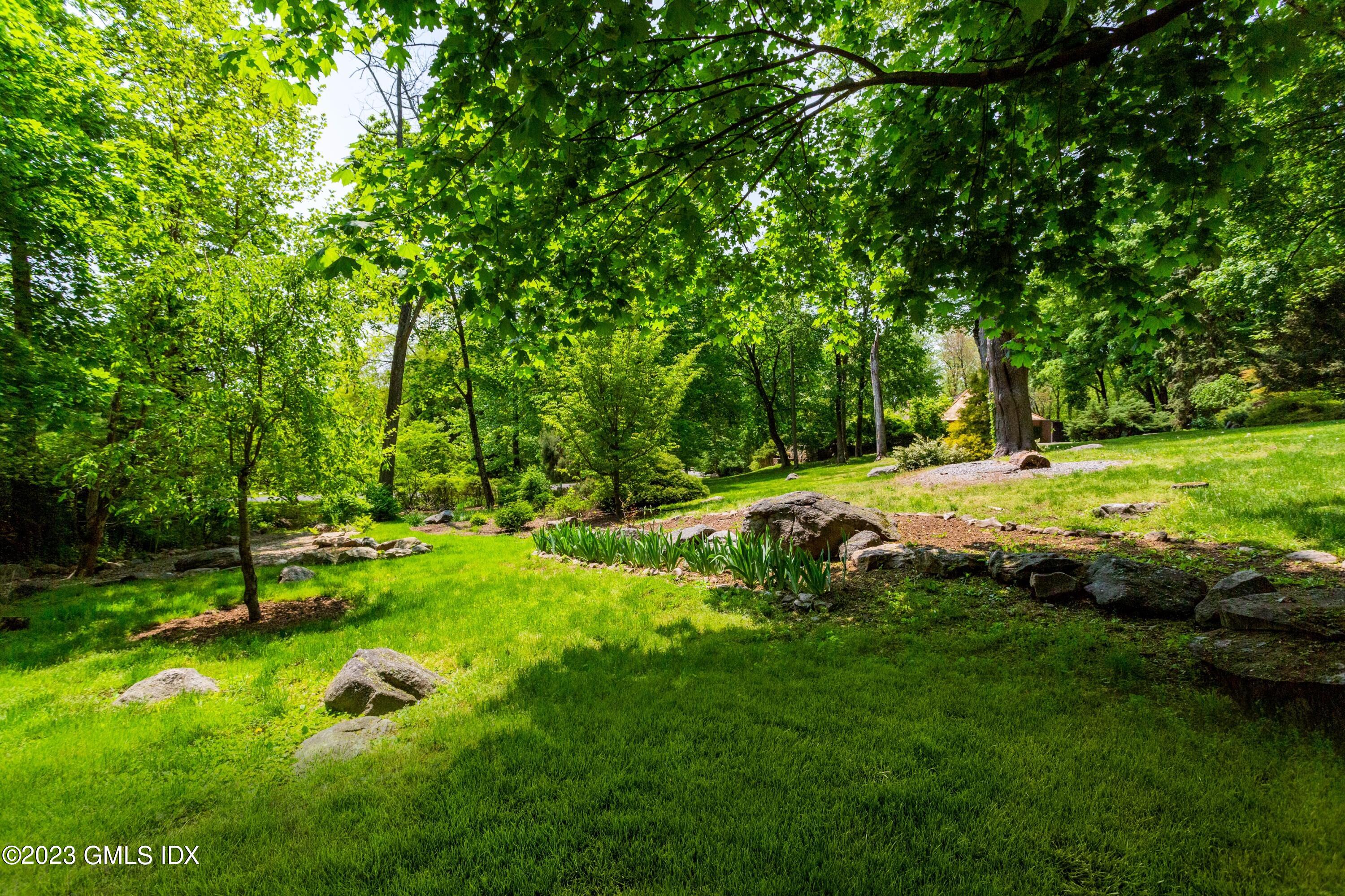 140 Round Hill Road Greenwich, CT 06831 - Photo 41 of 49 a view of a park with large trees