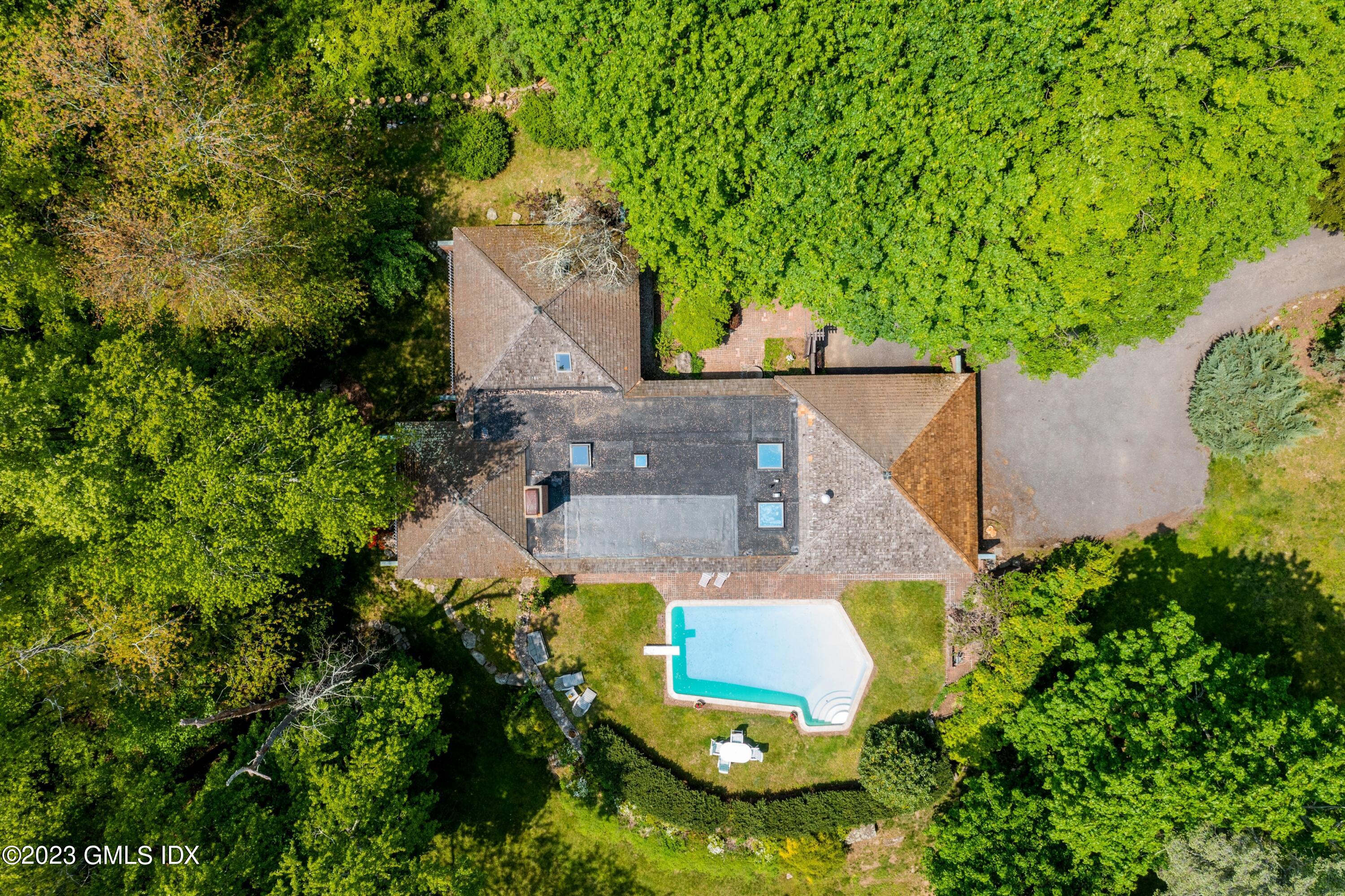 140 Round Hill Road Greenwich, CT 06831 - Photo 46 of 49 an aerial view of a house with a yard