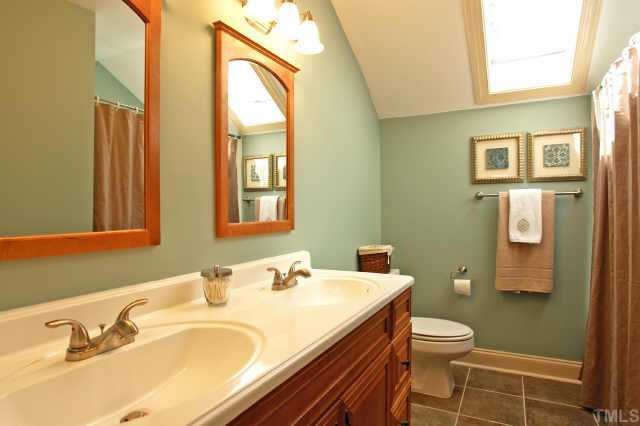 2832 Mattlyn Court Raleigh, NC 27613 - Photo 11 of 12 a bathroom with a sink and a mirror