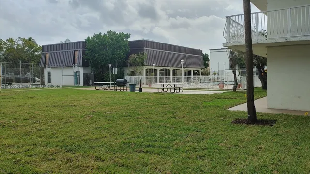 a house view with a sitting space and garden
