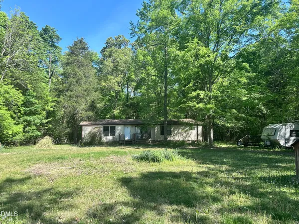 a view of a house with a big yard