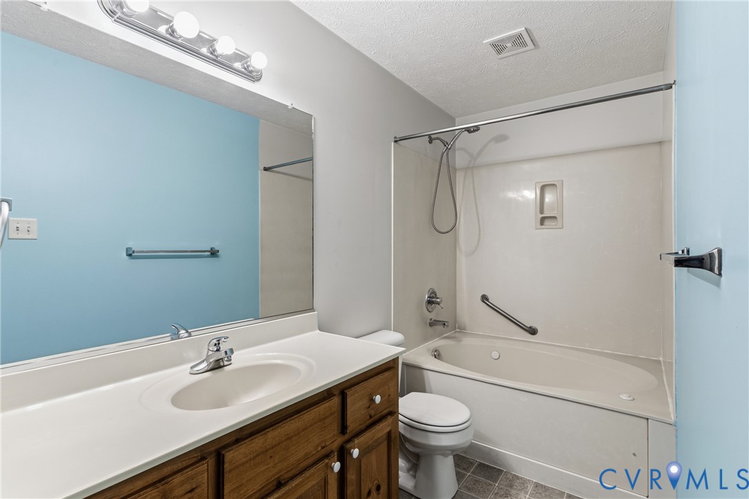 12654 Mt Olive Cohoke Road West Point, VA 23181 - Photo 19 of 31 a bathroom with a sink toilet and shower